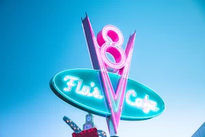 neon sign with the number 8 and an arrow pointing down